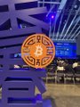 At a Bitcoin conference, a banner for Subfrost (featuring a Bitcoin "B" logo) hangs above an empty booth floor, illustrating the post's observation that Subfrost and the Alkanes protocol are the lone remaining representatives of the Bitcoin ecosystem at the event.