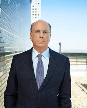 Larry Fink, CEO of BlackRock, stands in a dark suit and blue tie on an outdoor terrace. The image accompanies a post about BlackRock selling a significant amount of Bitcoin, valued at approximately $444.5 million.