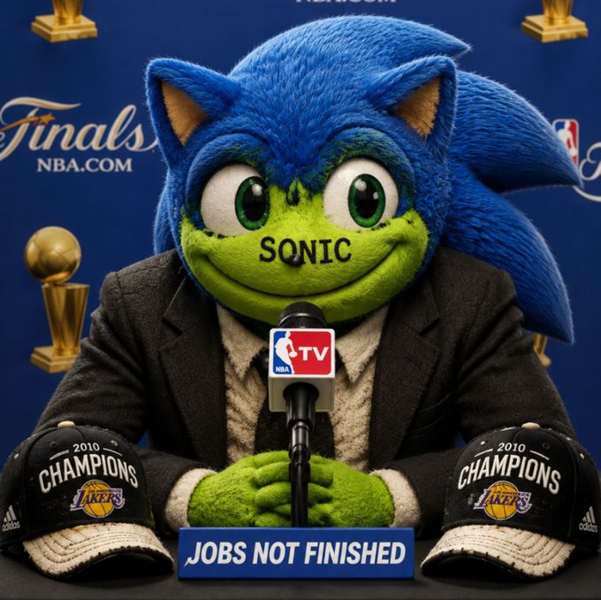 An image showing Sonic the Hedgehog dressed in a suit, sitting at a press conference podium with two Lakers championship caps and a 'JOBS NOT FINISHED' sign.