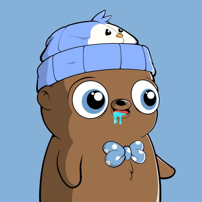 A cartoon illustration of a brown seal-like character with big eyes, wearing a blue beanie with a small bird on top and a blue polka-dot bow tie, with drool dripping from its mouth.