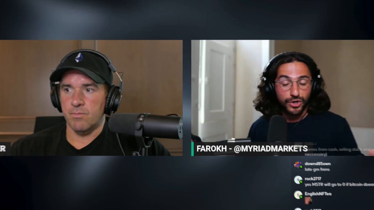 The image shows two men wearing headphones sitting at a desk with microphones in front of them. They are engaged in a conversation or discussion about cryptocurrency trading. The background appears to be a computer screen displaying a chat window, which includes text such as "Michael Saylor selling any amount of BTC, even if it's 1 Bitcoin, kills the mirage of never selling, one chair, etc." This suggests that they might be discussing strategies for buying and selling cryptocurrencies or sharing their experiences with trading.