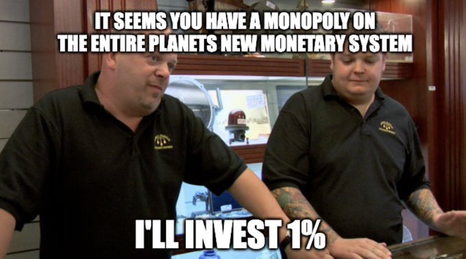 Two men in matching black polo shirts stand together with overlaid text reading 'IT SEEMS YOU HAVE A MONOPOLY ON THE ENTIRE PLANETS NEW MONETARY SYSTEM' and 'I'LL INVEST 1%'.