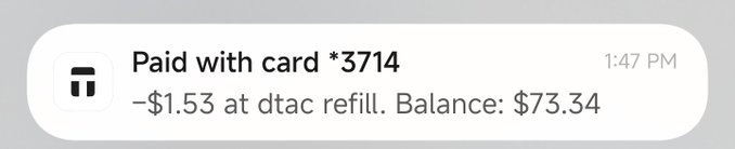 An iPhone payment notification showing 'Paid with card *3714 at 1:47 PM, −$1.53 at dtac refill. Balance: $73.34'.