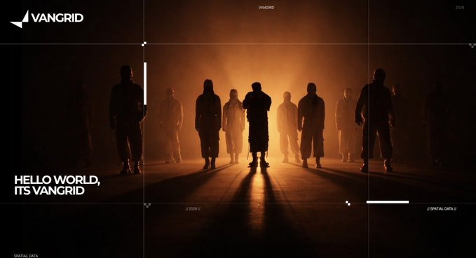 A group of silhouetted figures stands backlit by a bright orange light in a dark, smoky environment, accompanied by the text "VANGRID" and "HELLO WORLD, IT'S VANGRID".