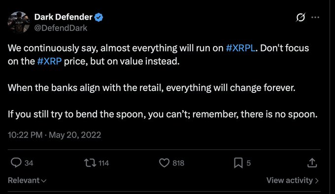 A tweet from verified user 'Dark Defender' (@DefendDark) stating 'We continuously say, almost everything will run on #XRPL. Don't focus on the #XRP price, but on value instead. When the banks align with the retail, everything will change forever. If you still try to bend the spoon, you can't; remember, there is no spoon,' posted at 10:22 PM on May 20, 2022.