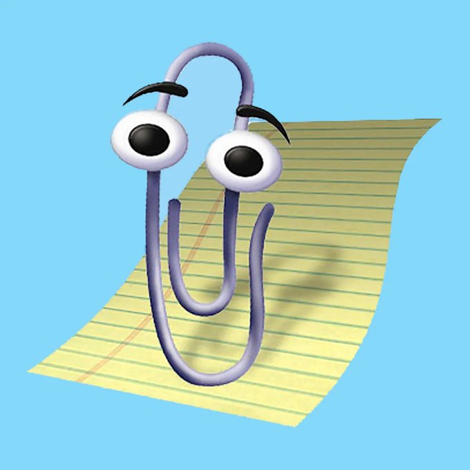 The image shows the iconic Microsoft Office Clippy paperclip mascot with his signature googly eyes and bent-paperclip body, sitting on a sheet of lined notebook paper. This matches the post announcing that the $CLIPPY token is now live on Robinhood Crypto with liquidity paired against $MSFT, humorously positioning Microsoft as the "floor" supporting Clippy's value.