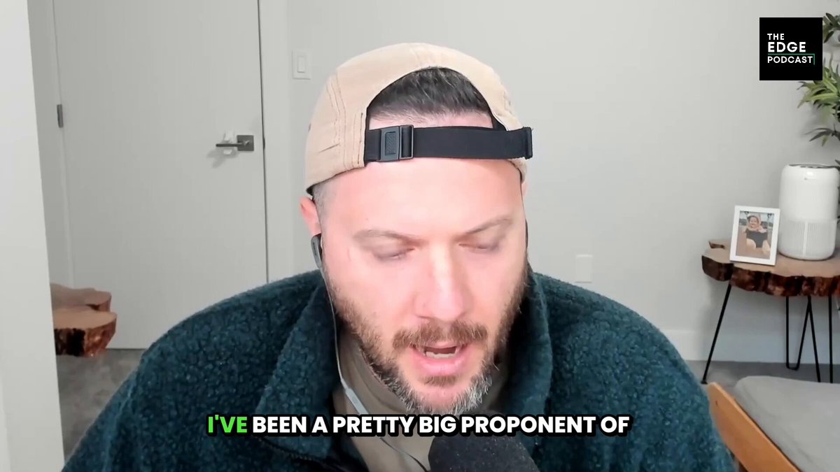 The image features a male man wearing a cap sitting down with his mouth open while talking into a microphone. He appears to be participating in an interview or live stream session where he shares some personal information, specifically that he has been a part of an initial coin offering for @tori_finance founder @0xNox_eth and they are planning on using their new tokenized carry trade in FX markets with an estimated yield of 15% APY. The image also contains the words "@Edge_Pod" which could be related to the podcast or video hosting service that was being used for the live stream.