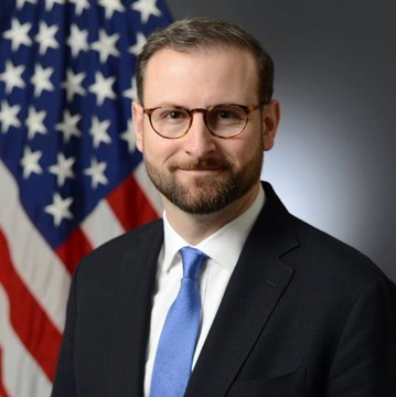 White House Crypto Adviser Patrick Witt, shown here in an official portrait with the American flag in the background, has publicly criticized the banking lobby for not actively pushing senators to pass the crypto CLARITY Act, calling their efforts "not serious."