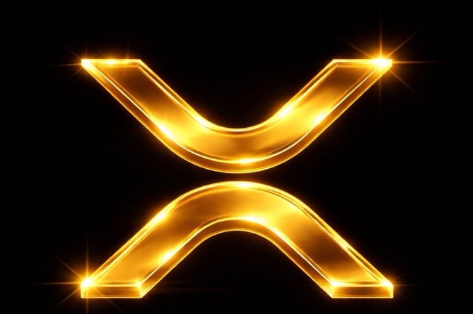 A glowing golden XRP logo set against a black background, featuring its iconic "X" design with bright starburst highlights. The luminous, polished emblem visually reinforces the post's "Lock In. $XRP" message by symbolizing the cryptocurrency's value and strength, encouraging viewers to commit to or hold the asset.