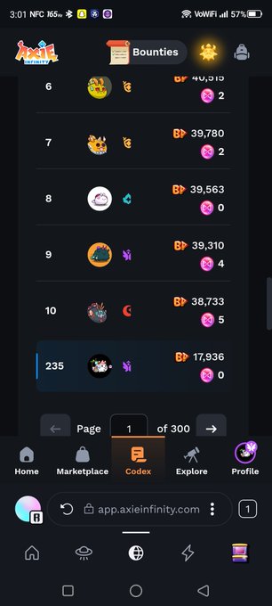 The image shows an app called "@AxieInfinity" that has a large screen displaying its features, including a game called "Bounties", which is a multiplayer game with various levels of difficulty. The app also offers a marketplace for players to sell and buy items within the game. There are multiple icons on the screen representing different aspects of the app or game, such as the marketplace, in-game purchases, and other game elements.