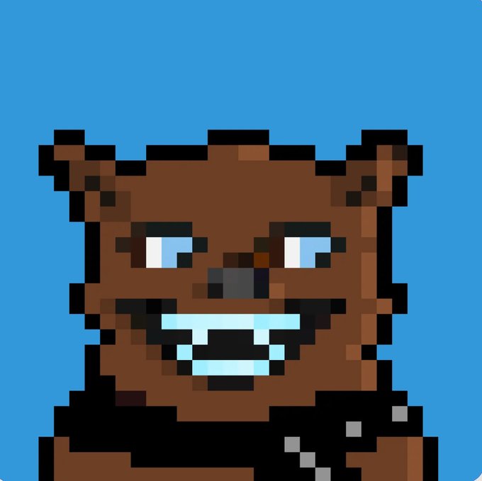 A pixel art rendering of a brown, bear-like character with blue eyes and prominent teeth against a bright blue background.