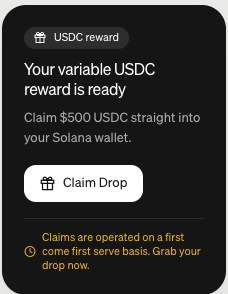 A notification claims "Your variable USDC reward is ready" with an offer to "Claim $500 USDC straight into your Solana wallet" via a "Claim Drop" button. The image relates to the post by appearing to be the very reward notification being mocked, highlighting the irony of being promised $500 in USDC when the user has never had $500 to their name.