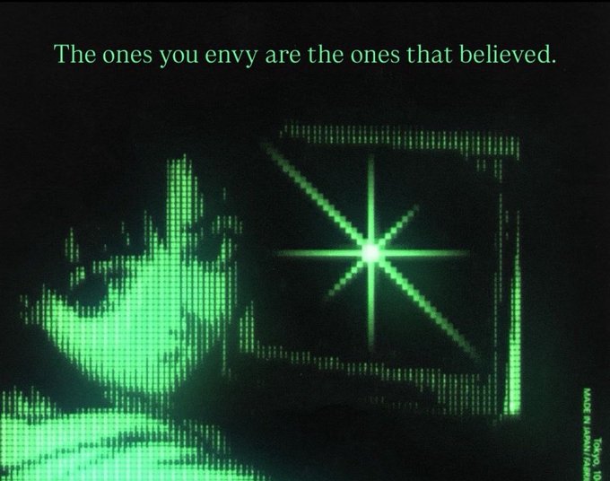 A green-tinted, retro-style digital image showing a silhouette of a person raising their hand. The text reads 'The ones you envy are the ones that believed.' alongside an ASCII art of a star and the text 'MADE BY WANGYI 1993'.