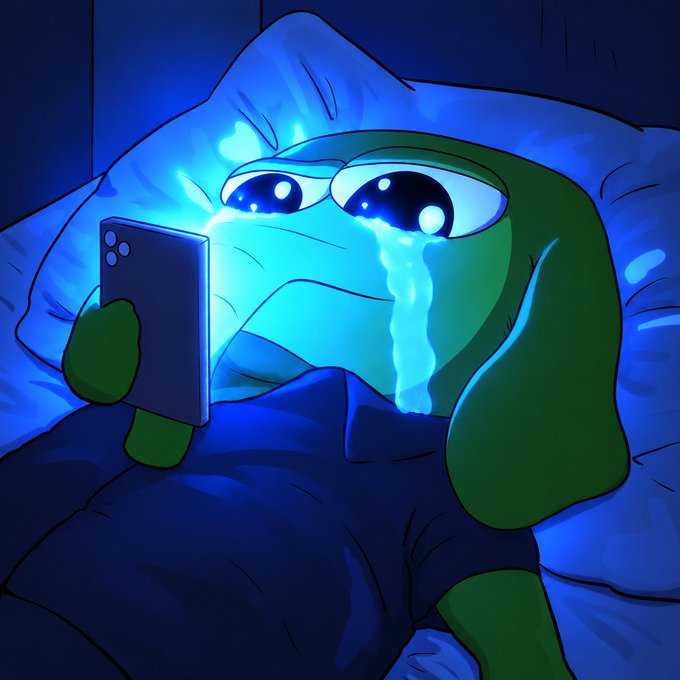 A digital illustration of a green frog-like character lying in bed under a blue blanket, holding a smartphone that illuminates its face as it sheds glowing cyan tears.