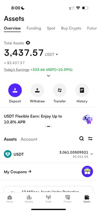 A mobile screenshot of a cryptocurrency app showing an 'Assets' overview with Total Assets of 3,437.57 USDT, today's earnings of +323.66 USDT (+10.39%), and tabs for Deposit, Withdraw, Transfer, and History.