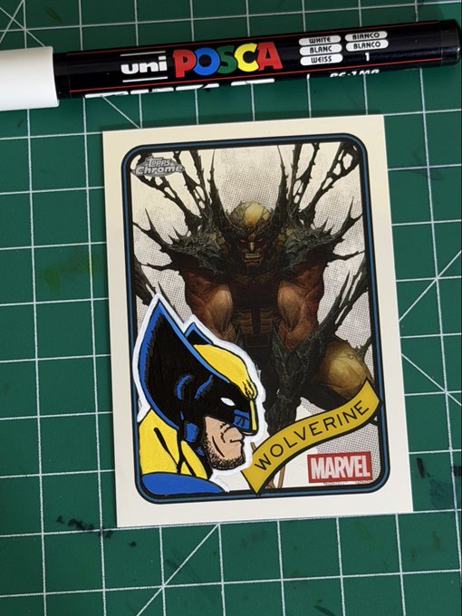 A hand-drawn Wolverine trading card with 'Topps Chrome' and 'MARVEL' logos sits on a green cutting mat next to a Uni POSCA white marker.