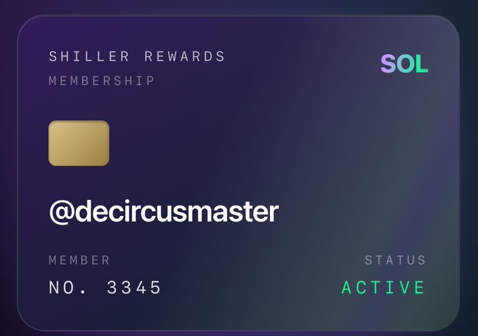 The image features a credit card with a purple background, a gold square at the top center, and a white text box below that reads "Shiller rewards membership". The text also includes a social media handle "@decircusmaster" and an active status of "active".