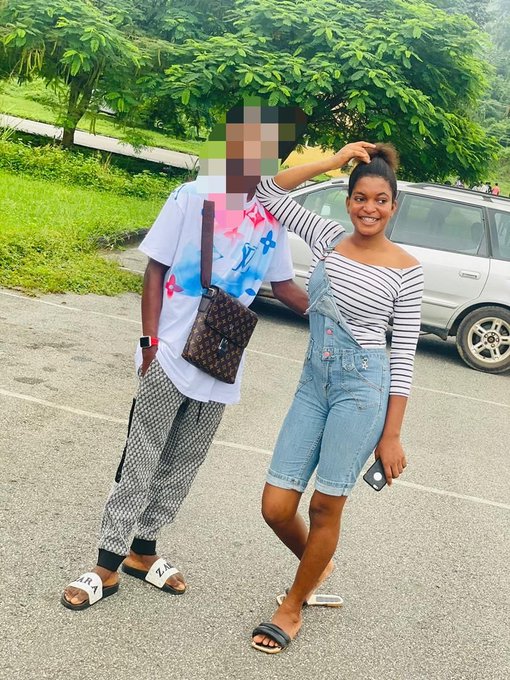A photo of two young people posing outdoors—one wearing a butterfly shirt with a Louis Vuitton bag, the other in denim overalls with a striped shirt.