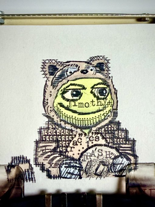 A typewritten drawing of a smiling character in a bear suit with the word 'Timothy' written across its face, layered over printed text.