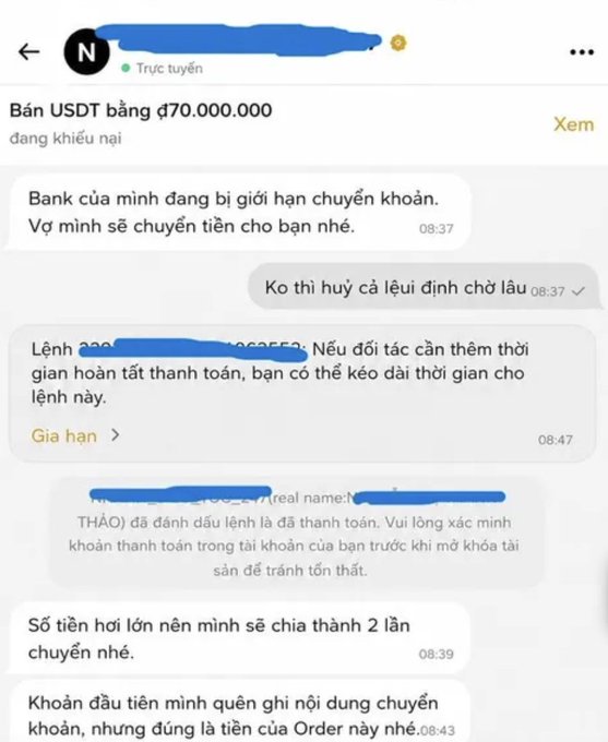 A screenshot of a Vietnamese-language chat conversation regarding a USDT transaction of 70,000,000, mentioning bank transfer limits and split payments.