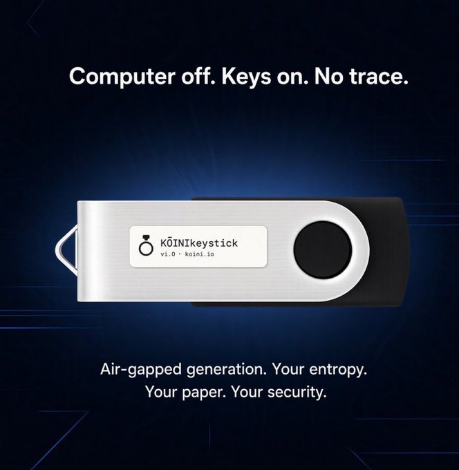 A promotional advertisement for the 'KŌINIkeystick v1.0' hardware cryptocurrency wallet, featuring an image of the silver USB-like device with the tagline 'Computer off. Keys on. No trace.' and 'Air-gapped generation. Your entropy. Your paper. Your security.'