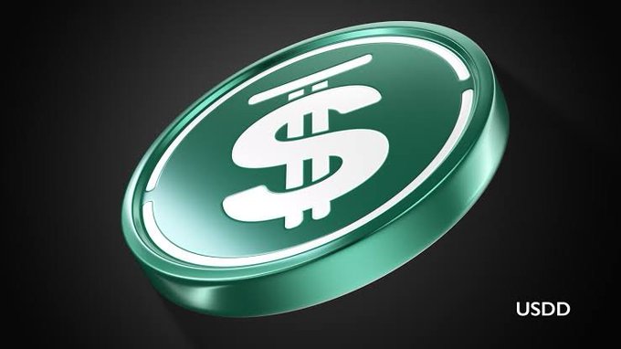 A 3D rendering of a green USDD cryptocurrency coin with a dollar sign symbol, labeled 'USDD' in the corner against a dark background.