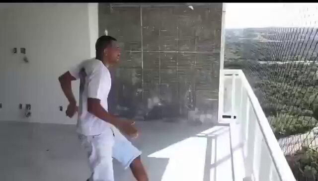 The image shows a man wearing white shorts, dancing on a balcony with his arms outstretched as if he's about to jump into the air. The balcony has a window that overlooks a cityscape below. In the background of the image, there is a sign that says "Me trying to make Bitcoin hit $58k one more time..." This suggests that someone might be attempting to create a video or content related to Bitcoin and its value, possibly for marketing purposes or to share with others.

The man's dance moves and the cityscape in the background give off an energetic vibe, which could be interpreted as a celebration of success or achievement in the world of cryptocurrency. The image might also serve as a reminder that people can use various platforms to express their creativity and ideas, even if it is just for fun or entertainment purposes.