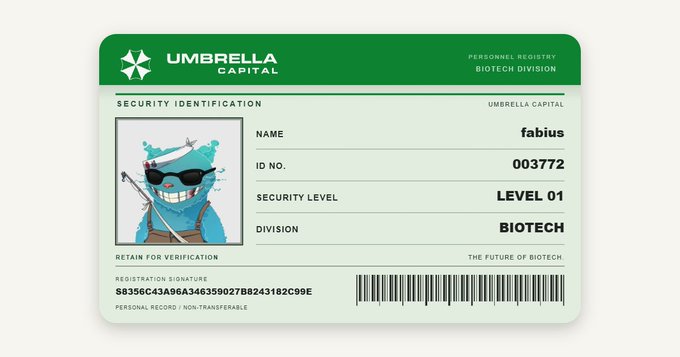 An 'Umbrella Capital' security identification card featuring a blue cartoon mascot with sunglasses, listing the name 'fabius', ID No. 003772, Security Level 01, in the Biotech Division.