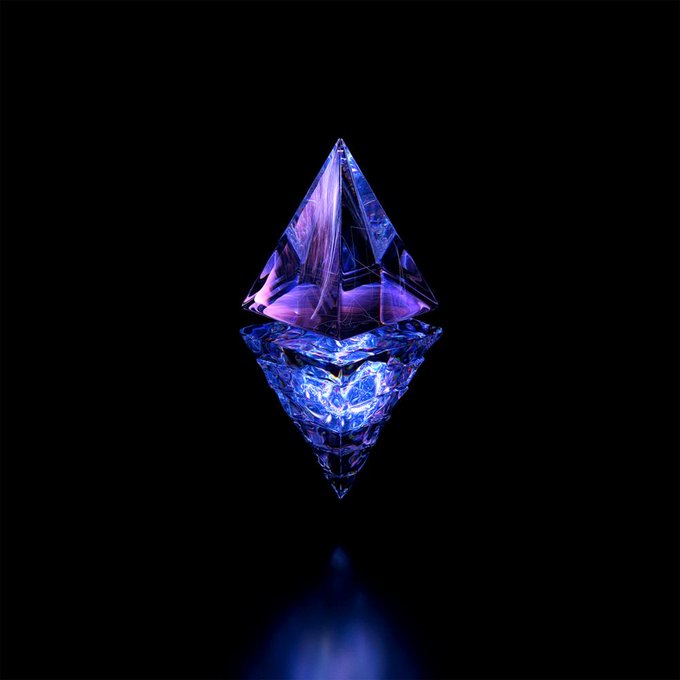A glowing purple and blue crystalline Ethereum logo diamond shape against a black background, reflecting on a surface below.