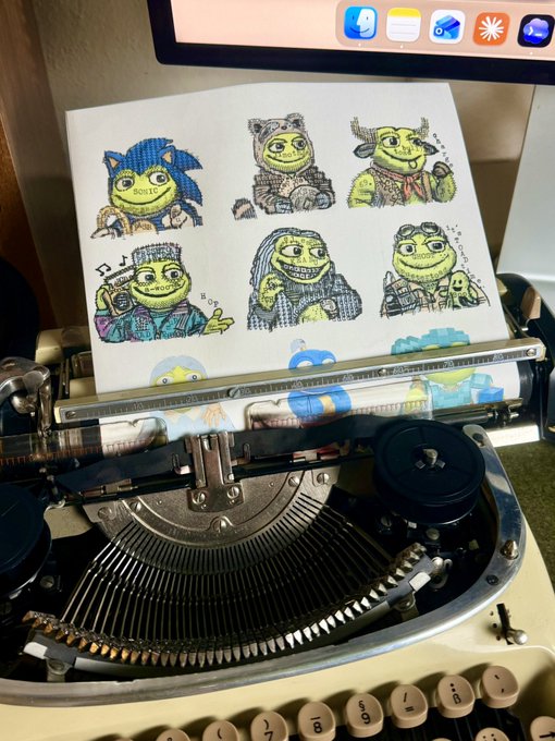 A vintage typewriter displaying a piece of paper with multiple hand-drawn illustrations of a green, Shrek-like character in various poses and outfits.