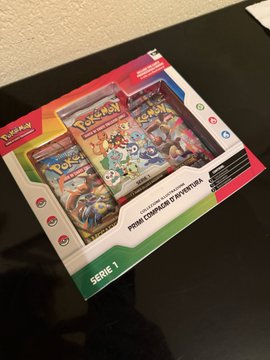 A Pokémon Trading Card Game Series 1 Premium Champion Display box sits on a dark surface, featuring classic starter Pokémon artwork on its packaging. While the post celebrates the "MadLads" web3 NFT collection, the image instead showcases a nostalgic Pokémon TCG product, sharing a similar collector/hype culture vibe.