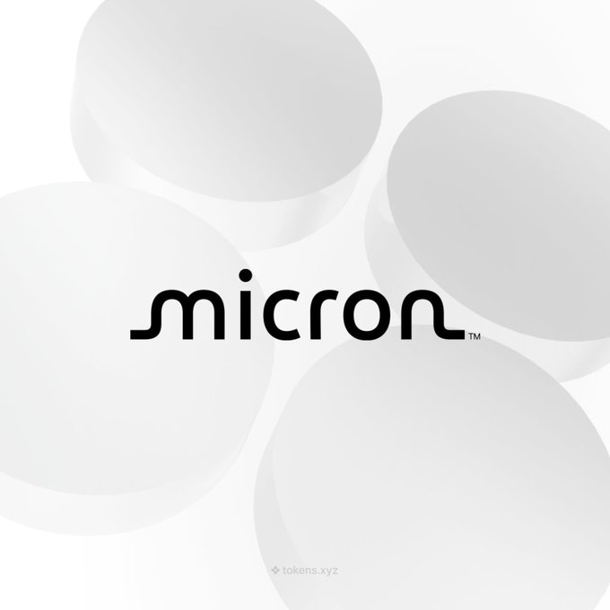 The image displays the "micron" logo in a stylized, rounded lowercase font with a trademark symbol, set against a white background featuring soft, overlapping translucent circles. The Micron branding directly represents the company ($MU) referenced in the announcement of its $3 billion semiconductor supply chain investment and its tokenized availability on Solana.