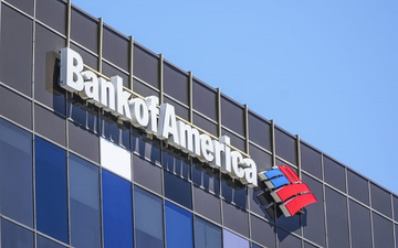 The image shows the Bank of America logo and signage on the exterior of a glass office building against a blue sky, visually identifying the financial institution referenced in the post about its significant Q2 portfolio rotation away from MicroStrategy (MSTR) shares and heavily into BlackRock's Ethereum ETF (ETHA).