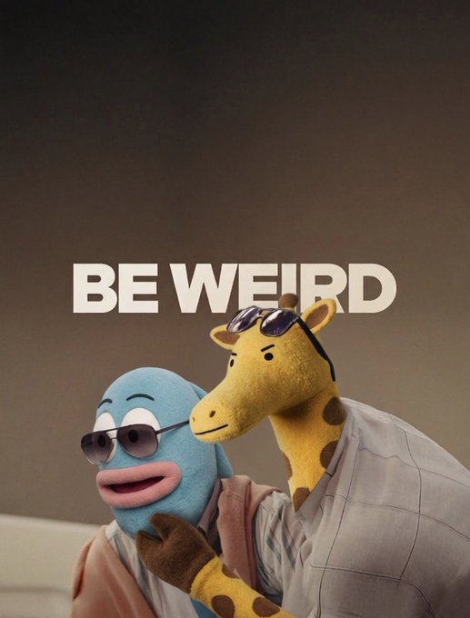 Two quirky puppets—a blue creature and a yellow giraffe—wear sunglasses under the bold white text 'BE WEIRD'.