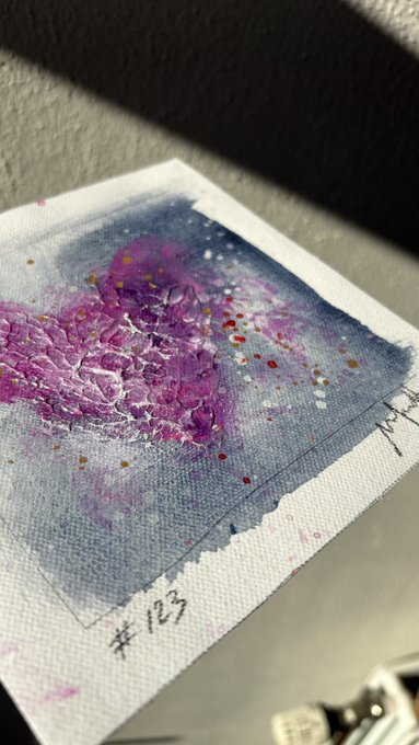 A small watercolor or ink artwork in blue and purple tones on textured paper is shown, marked '#123' in the corner.