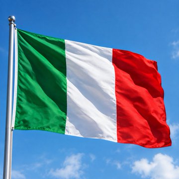 The image shows the Italian flag waving against a clear blue sky. This visual ties into the post about hackers breaching an Italian government email account to impersonate police and access Revolut customer data, highlighting Italy's involvement in the cybersecurity incident.