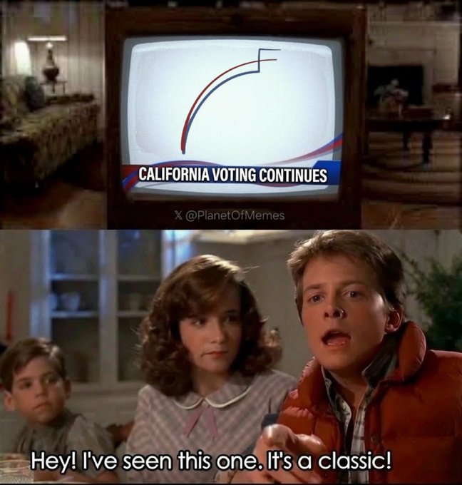 Two individuals, a young woman and a young man, participate in a television interview about the California voting process, with a third person seen through their glasses in the background.