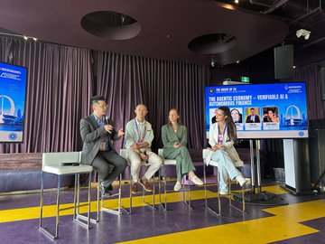 Four people sitting on stools on a stage participating in a panel discussion; a screen behind them reads 'THE STATE OF ASIA: RECONNECTING BRIDGES TO THE PRIVATE CAPITAL FUNDS'.