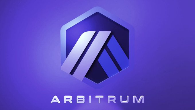 The Arbitrum cryptocurrency logo featuring a blue hexagonal emblem on a purple gradient background with the text 'ARBITRUM' below.