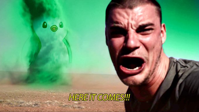 A meme image showing a man's panicked face reacting to a green cartoon tornado approaching in a desert landscape, with yellow caption text reading 'HERE IT COMES!!!'