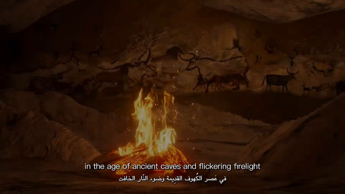 The image features a captivating scene with an ancient cave fire burning brightly at its center. The fire's flames are dancing around the cave walls, creating a mesmerizing display. In the background, there are several deer depicted as reindeer or antelope, adding to the overall sense of wilderness and adventure. Above this scene, the sky is filled with clouds, suggesting that it might be a cloudy day. The image also includes text in another language, which could potentially be an explanation for the ancient cave fire's origin or significance within the context of the post.