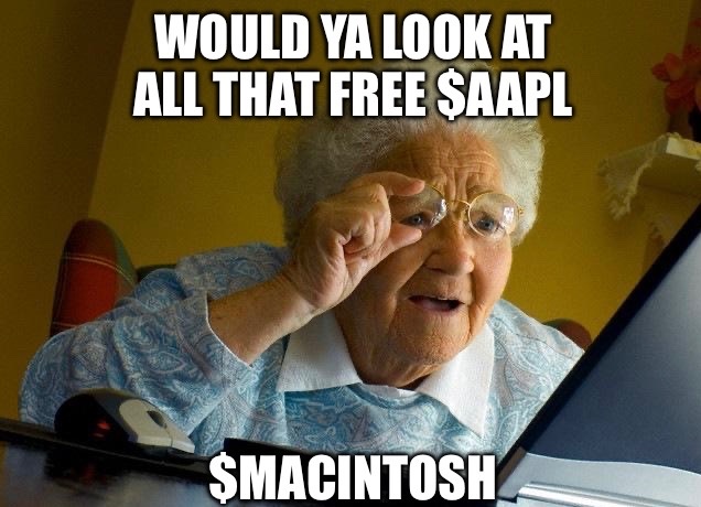 A meme featuring an elderly woman looking inquisitively over her glasses at a laptop, with the caption 'WOULD YA LOOK AT ALL THAT FREE $AAPL' above and '$MACINTOSH' below.