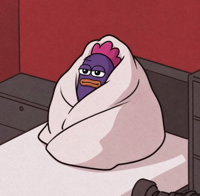 A cartoon character with a purple comb and orange beak sits bundled up in a blanket on a bed, looking unimpressed. The image humorously illustrates the post's sentiment of waiting impatiently for "Monad season," with the cold, wrapped-up character embodying the chilly anticipation for the crypto project's launch.