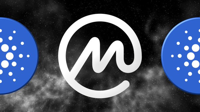 The image features a stylized white "M" logo with a swoosh design centered against a cosmic, starry background, flanked by two blue circular icons containing white dotted patterns that represent the Cardano (ADA) logo. This visual relates to the news that CoinMarketCap has ranked Cardano as the #1 most bullish daily trending and #8 most bullish community sentiment cryptocurrency.