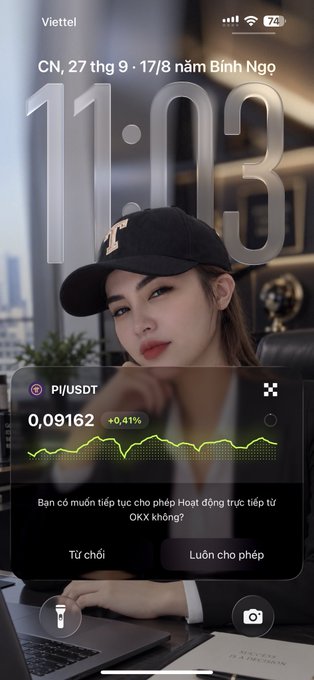 A smartphone lock screen shows a woman wearing a black cap with an '11:03' time display, alongside a Pi/USDT widget requesting real-time price updates.