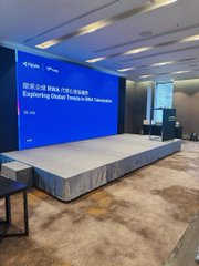 The image shows a stage set up for a Ripple-sponsored event, with a large screen displaying the title "Citi On-Demand Liquidity and Expanding Global Treasury With Stablecoins." This visually reinforces the post's theme of tokenization in finance, highlighting Ripple's role as a one-stop shop for implementing blockchain solutions in cross-border payments, alongside mentions of DBS, Franklin Templeton, and the RLUSD and sgBENJI tokens.