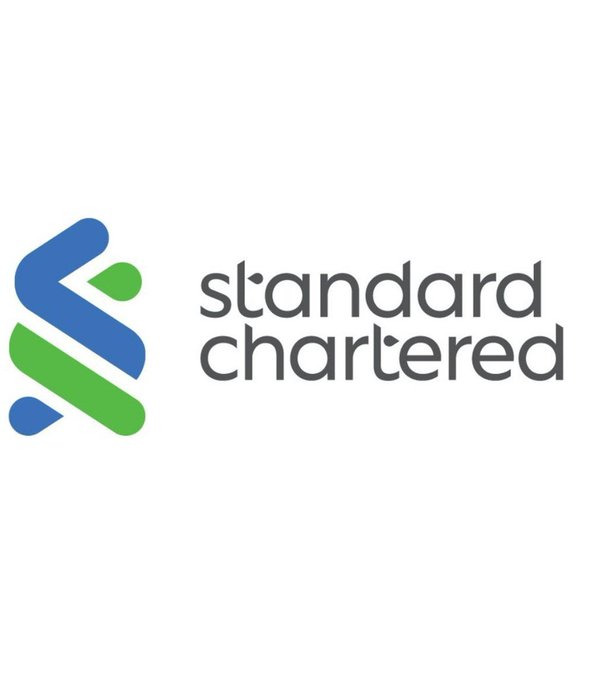 The Standard Chartered bank logo featuring blue and green intersecting arrows next to the company name.