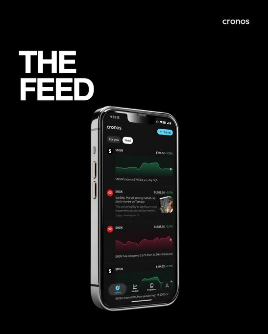 The image is a promotional graphic for "The Feed" by Cronos, displayed on a smartphone against a black background, showing stock tickers like $MSM and $SNK with real-time price movements (e.g., $104.50, $138.50) and chart data. The accompanying post emphasizes the feed's purpose for trading and watching markets in real-time, aligning with the app's interface designed for tracking financial activity anytime.