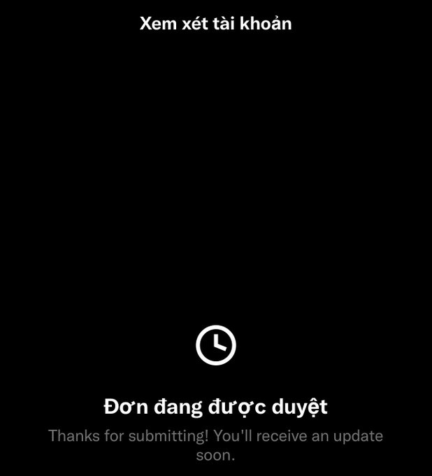 A mobile app screen with Vietnamese message 'Xem xét tài khoản' (Review account) at the top and 'Đơn đang được duyệt' (Submission is being reviewed) at the bottom, with the English text 'Thanks for submitting! You'll receive an update soon.'