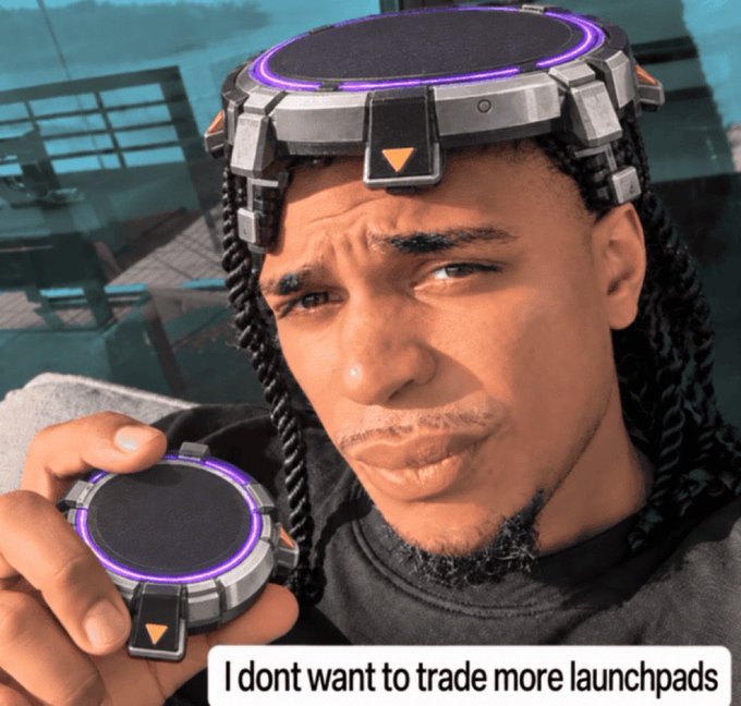 A young man with dreadlocks wears futuristic headgear with a purple ring and holds a matching circular device, with text reading "I dont want to trade more launchpads."